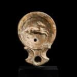 Roman oil lamp with leaping stag Antiquities