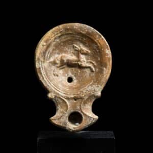 Roman oil lamp with leaping stag Antiquities