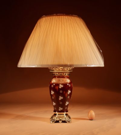 A French Ceramic And Brass Table Lamp. 
