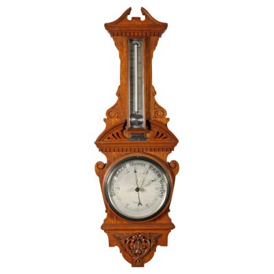 An Edwardian Oak Cased Aneroid Barometer