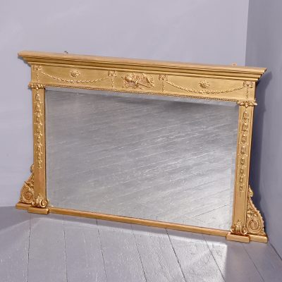 Neat size Regency Gilded Overmantel Mirror with Neoclassical Decoration