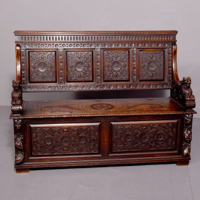 A Large Carved Oak Hall Bench