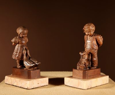 Black Forest Original Pair Of Fine carved Sculptures Of A Boy And Girl.