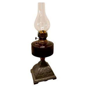 Cranberry Glass Oil Lamp on Decorative Iron Base