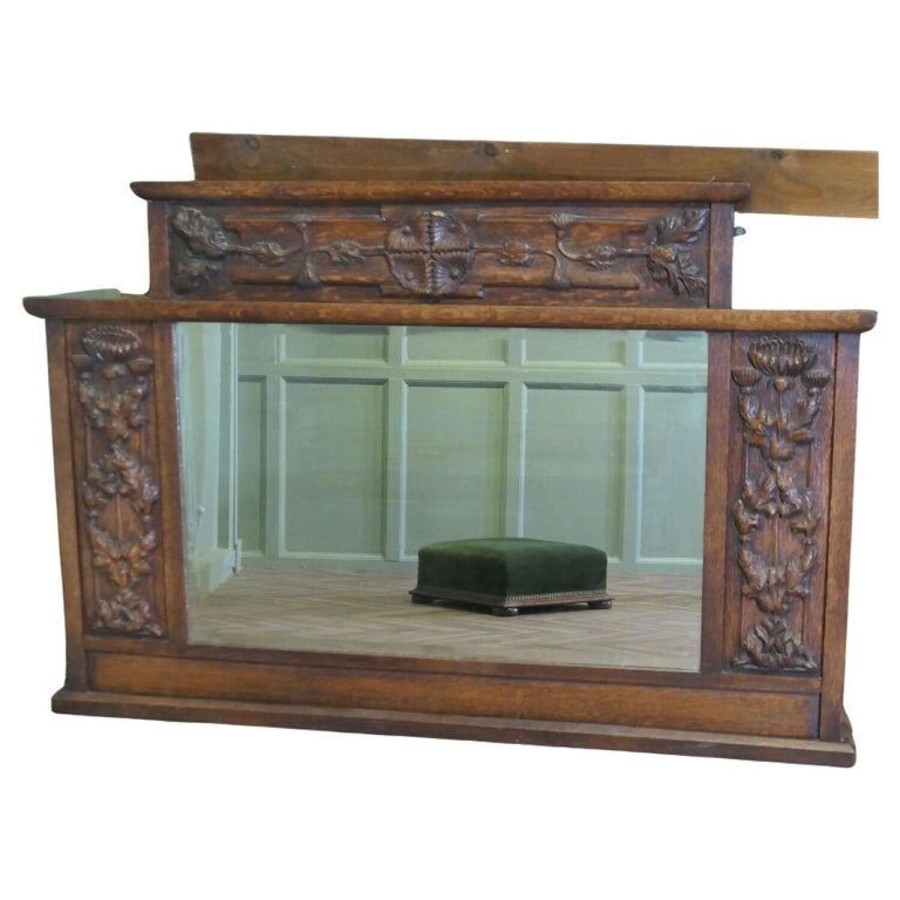A Large Arts and Crafts Carved Oak Overmantel or Wall Mirror