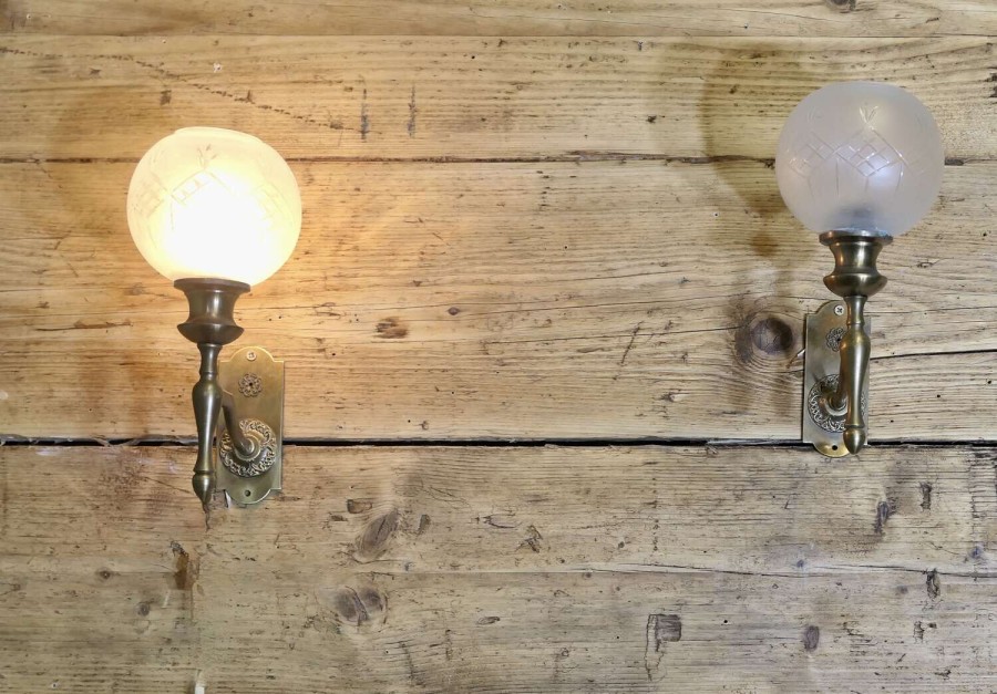 A pair of Art Deco Etched Glass Globe Wall Lights