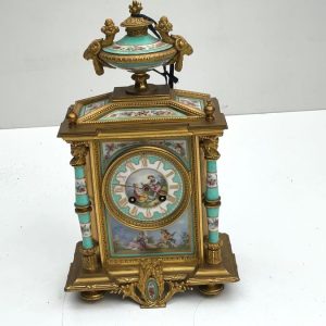 FRENCH MANTEL CLOCK WITH SERVES PANELS
