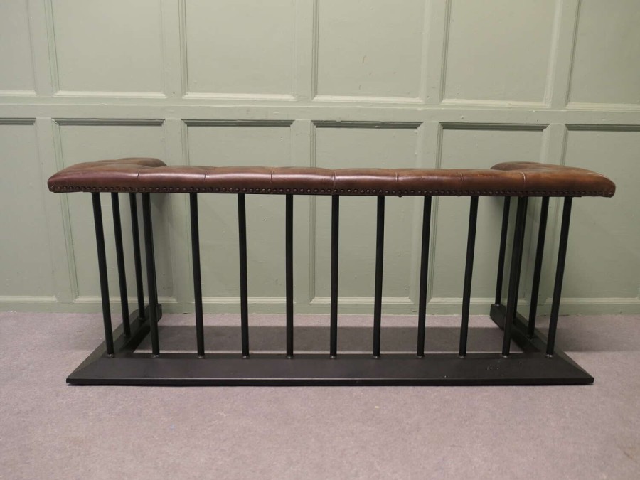 A Wrought Iron and Leather Fire Side Seat, Club Fender This is a grand piece
