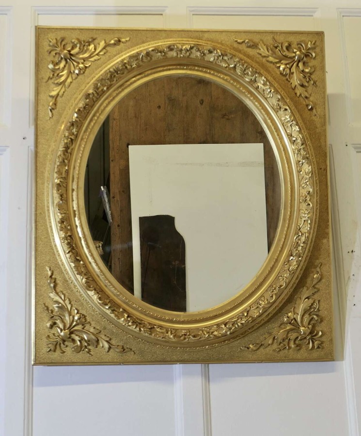 Large Very Decorative Gilt Oval Panel Mirror This is an outstanding piece, the oval centr