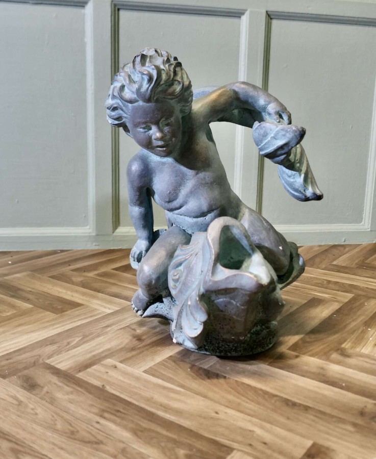 Sculpture of a Cherub Riding a Fish, Fountain Water Feature A superb verdigris patinated