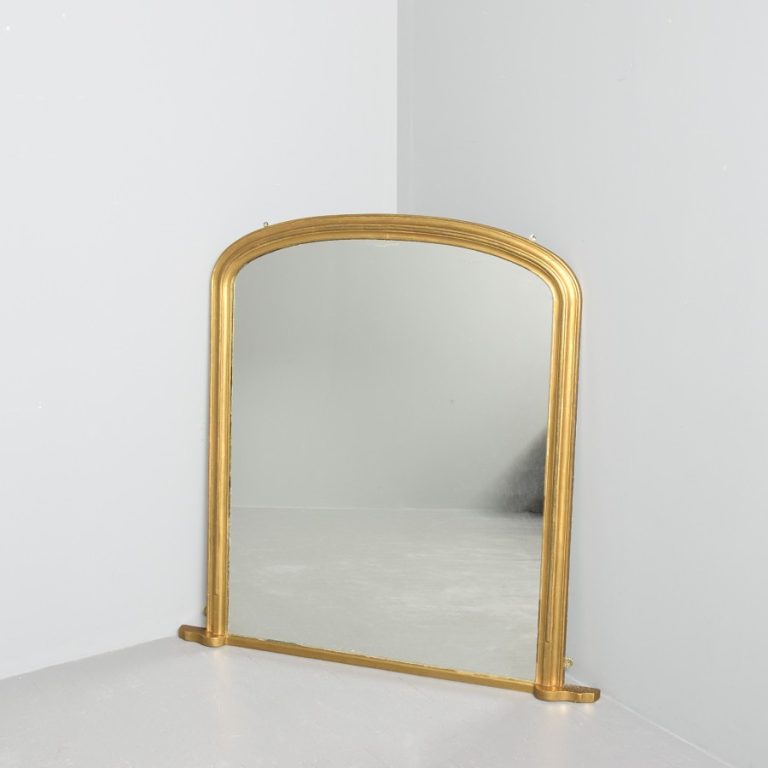 Mid-Victorian arched gilded overmantel mirror with original mirror plate, traditionally restored.