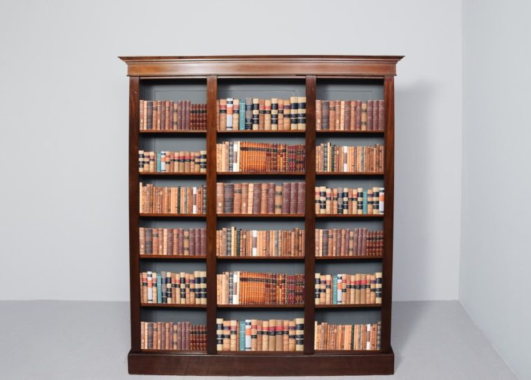 Late Victorian, inlaid mahogany, Sheraton-style three-section open bookcase with adjustable shelves