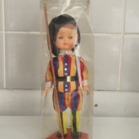 Vintage souvenir doll depicting a Swiss Guard in traditional uniform