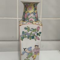 Porcelain vase with polychrome enamel decoration depicting children at play and floral motifs