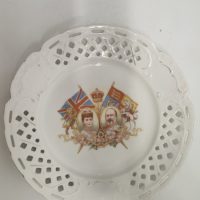 Porcelain commemorative plate featuring King George V and Queen Mary