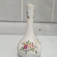 Porcelain bud vase with hand-painted rose decoration