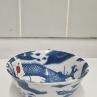 Porcelain bowl with blue dragon motif, made in Japan