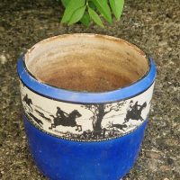 Stoneware mug with cobalt blue glaze and white relief-molded hunting scene