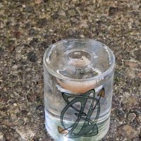 Mid-century modern art glass shot glass with geometric atomic design