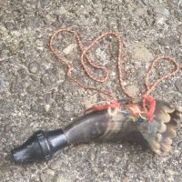 Carved horn powder flask or priming horn with decorative hand grip
