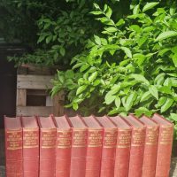 Set of 11 red cloth-bound volumes from ‘The Waverley Novels’ by Sir Walter Scott, published by Collins Clear-Type Press