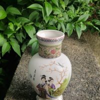 Porcelain baluster vase with polychrome decoration depicting geishas and flowering tree