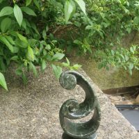 Hand-carved stone sculpture in abstract spiral form