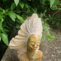 Stone sculpture titled ‘Woman with Flowing Hair’
