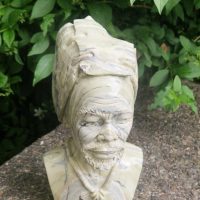 Stone sculpture titled ‘village leader