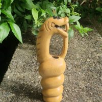 Hand-carved wooden sculpture of Nyami Nyami, the Zambezi River serpent spirit, by Shona artisan