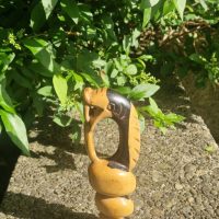 Hand-carved wooden sculpture of Nyami Nyami, the Zambezi River serpent spirit, by Shona artisan