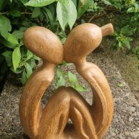 Hand-carved wooden sculpture titled ‘Kissing Couple’ or ‘Circle of Love’, Indonesian origin