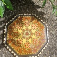 Octagonal wooden tray with geometric marquetry inlay and bone or mother-of-pearl border