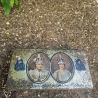 Metal commemorative tin celebrating the 1937 Coronation of King George VI and Queen Elizabeth, manufactured by Rowntree