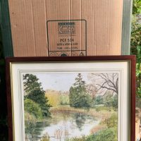 Watercolor painting depicting a tranquil river landscape with trees and reflections