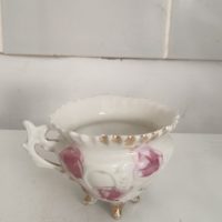 small, antique footed porcelain cup or bowl