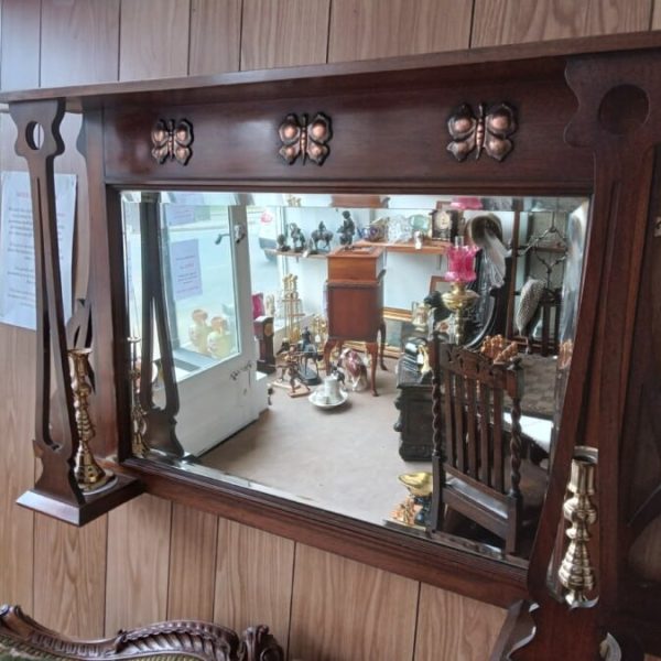 AN ART NOUVEAU OVERMANTEL MIRROR IN MAHOGANY