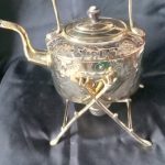 VICTORIAN BRASS EMBOSSED SPIRIT KETTLE.
