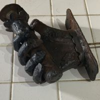Wrought iron hand holding a spills converted to electric