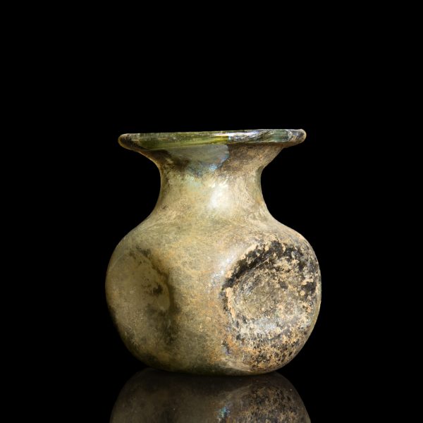 Roman glass jar with indented sides