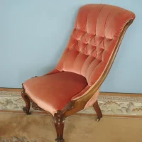 Ornately carved button back nursing chair