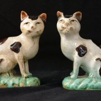 A pair of faience cats