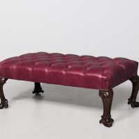 Large, Georgian-style mahogany-framed, buttoned red hide upholstered footstool