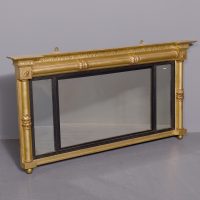 Neat-sized, Regency period gilded triptych overmantel mirror with acanthus decorated columns.
