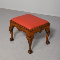 George 2nd style walnut bench/stool in figured walnut newly upholstered in burgundy leather