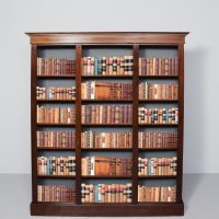 Late Victorian, inlaid mahogany, Sheraton-style three-section open bookcase with adjustable shelves