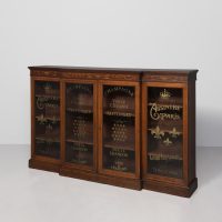 Late Victorian inlaid mahogany Sheraton-style 4 door breakfront bookcase with gilded champagne labels on the glazed doors