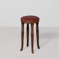 An unusual style mahogany circular George 3rd stool with leather upholstery