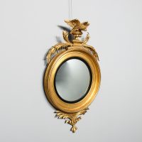 Magnificent Regency period eagle-mounted giltwood convex mirror