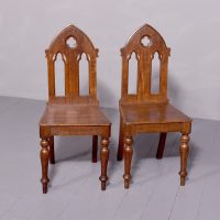 Stylish pair of Victorian pitch pine oak Gothic hall chairs